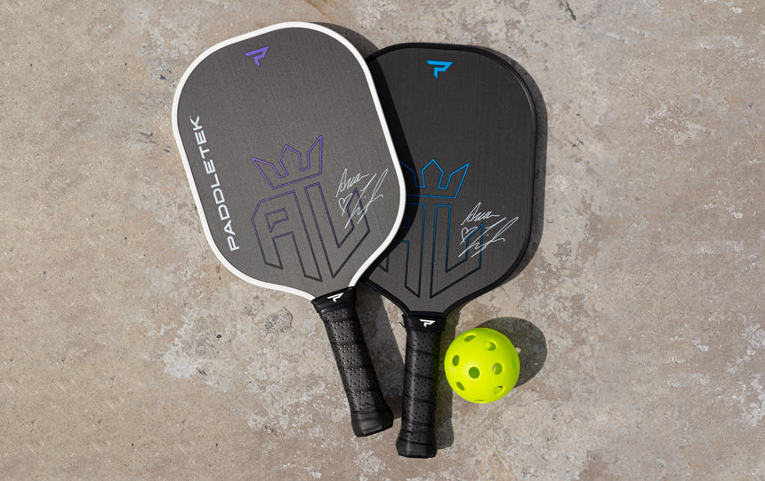 paddletek paddles and single pickleball on ground