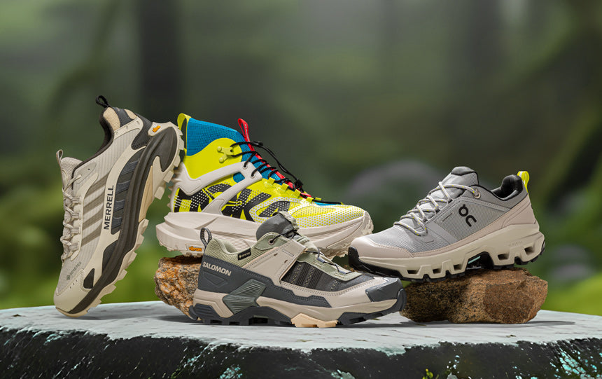 new balance hoka merrell hiking shoes on white background