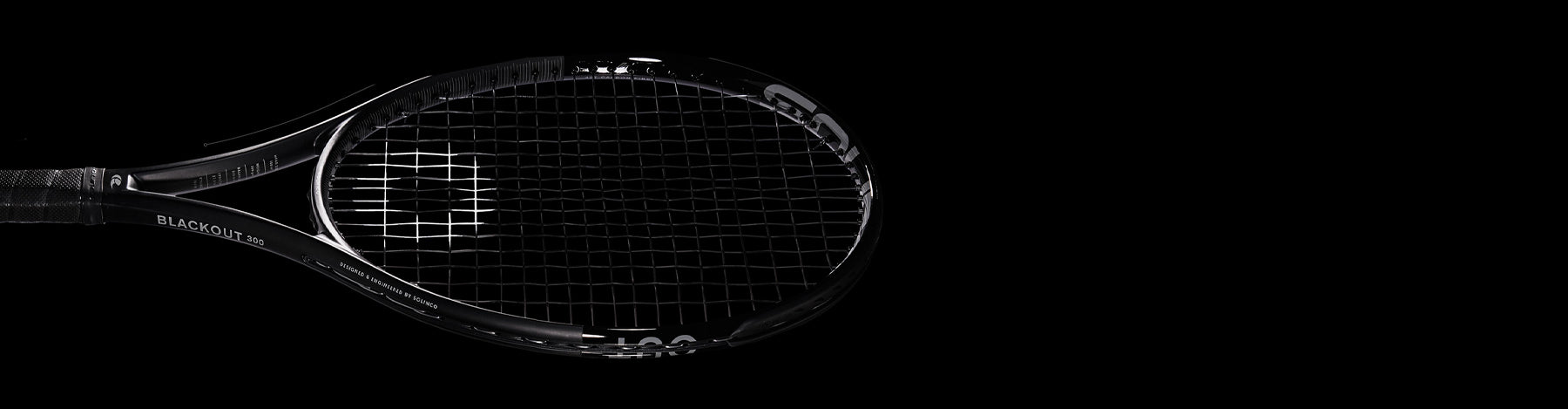 Solinco Blackout tennis racquet on a black background.