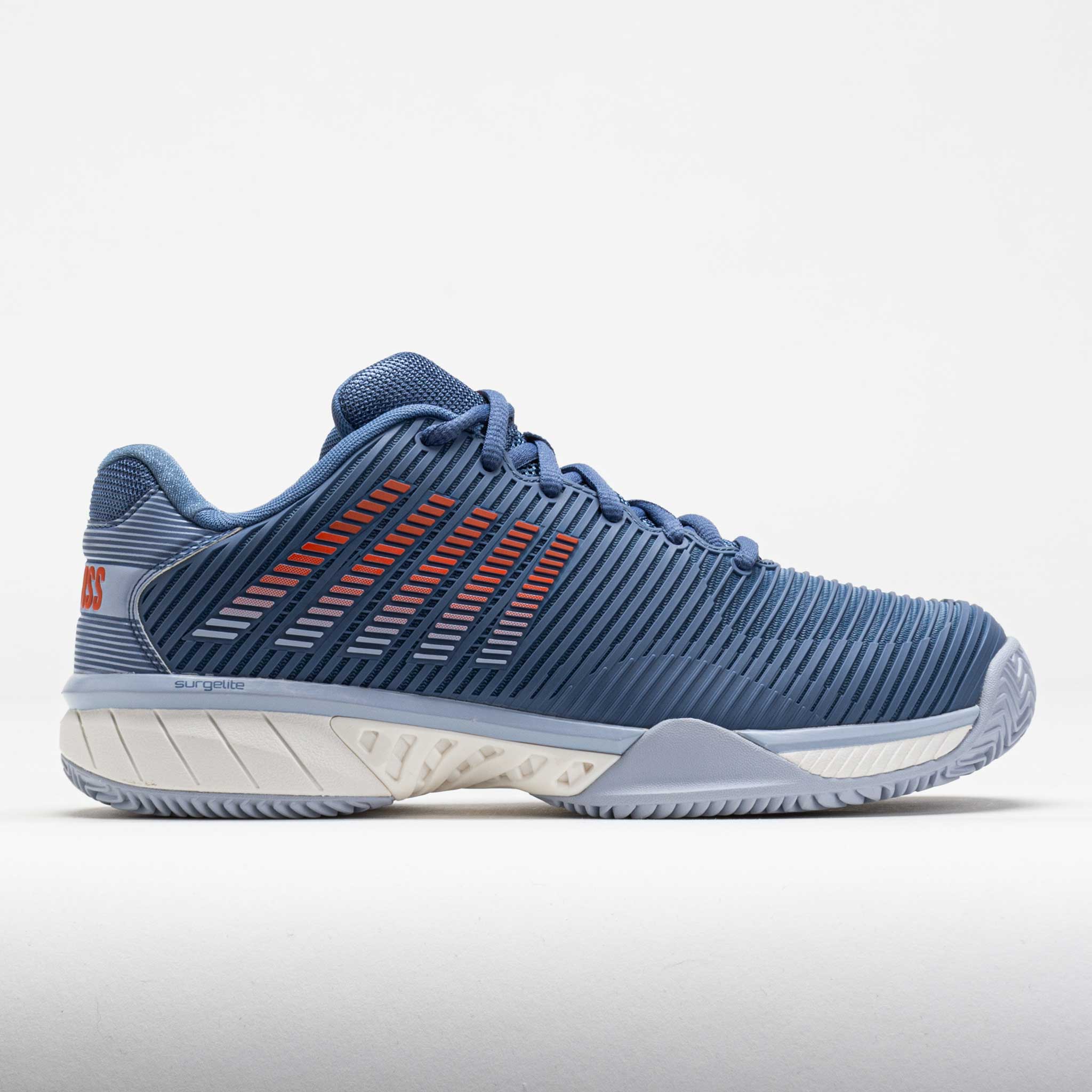A pair of K-Swiss Hypercourt Express 2 Clay men's tennis shoes in Infinity/Arctic Ice/Scarlet colors, featuring a mesh upper material and a rubber outsole.
