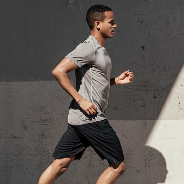 man running, cement background