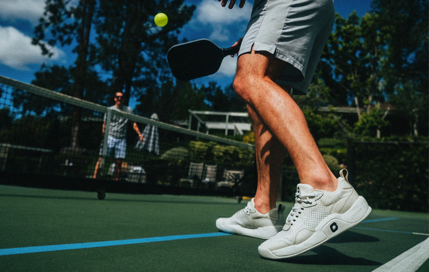 Pickleball players on a pickleball court wearing the Cypher Pickleball Key211 shoes.