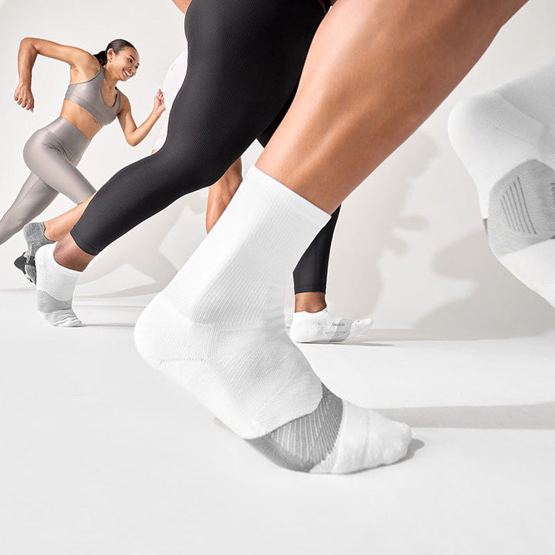People running in Feetures socks