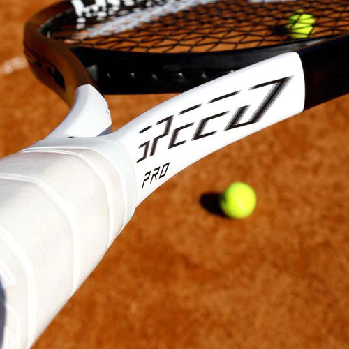 Close black and white tennis racquet and balls