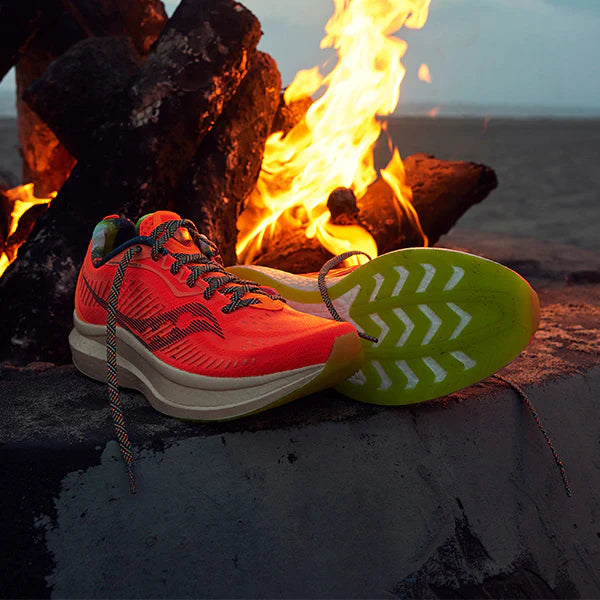 Saucony shoes with yellow sole and fire background