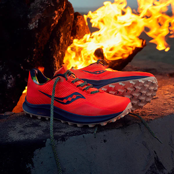 Saucony shoes with white soles and fire background