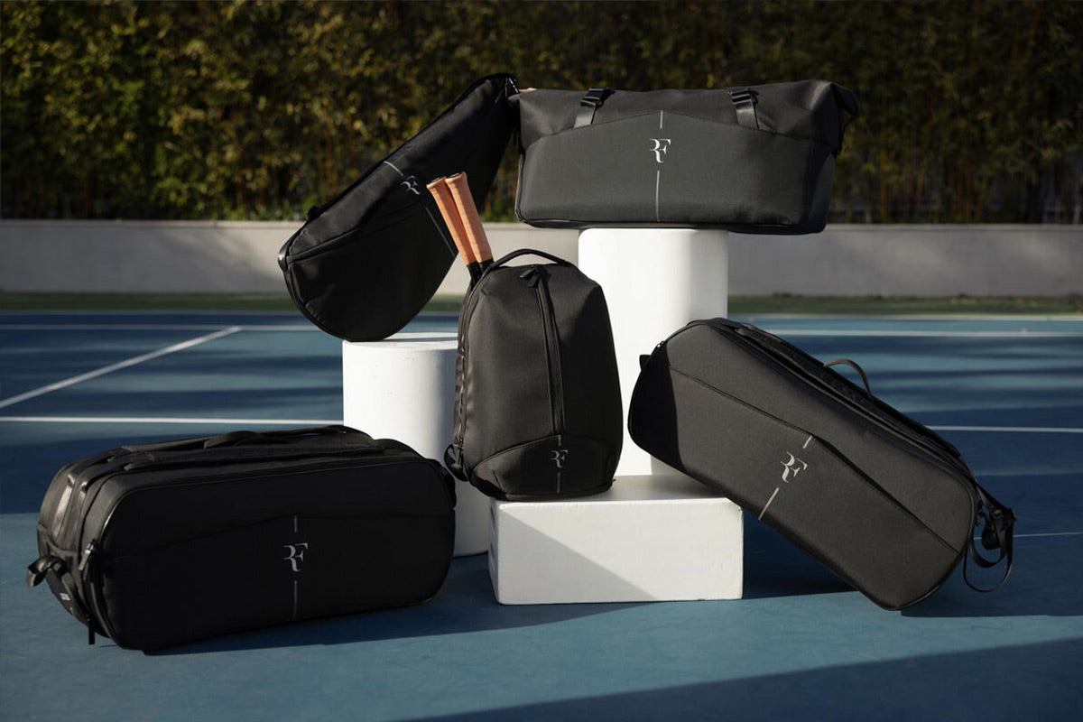 an image showing multiple tennis racquet bags from the Wilson RF collection designed in collaboration with tennis legend Roger Federer.