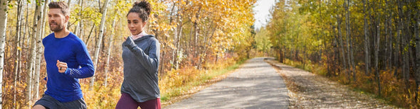 Woman and man running in Brooks 2018 fall collection