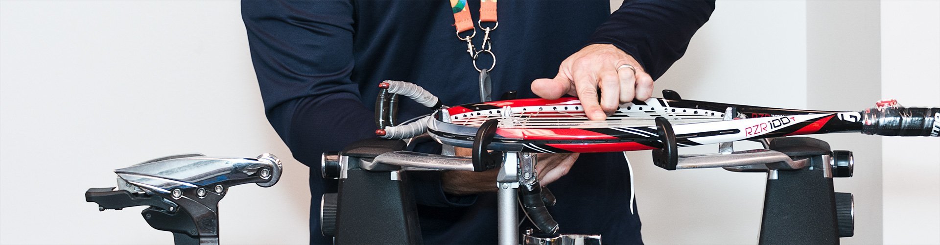 Man stringing tennis racquet