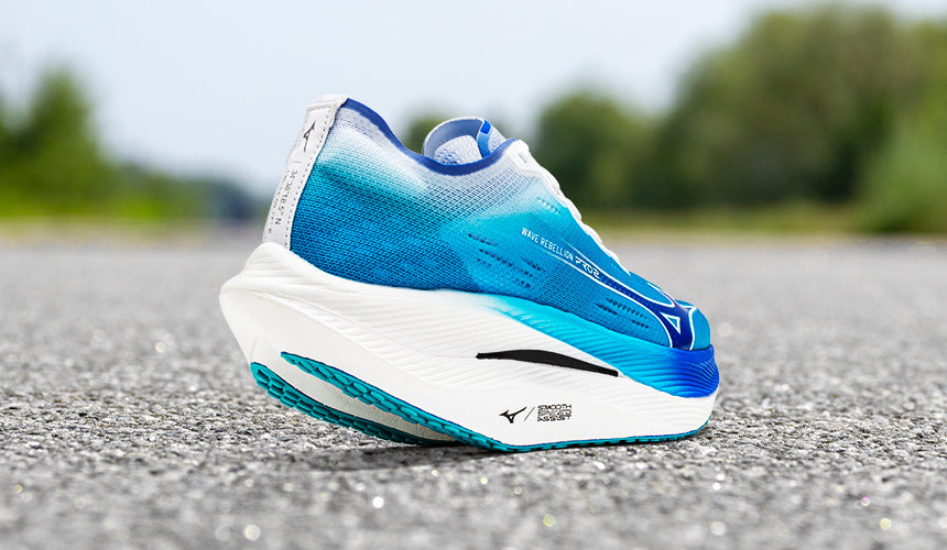 mizuno wave rebellion running shoes sitting on the street