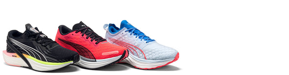 women's puma running shoes on white background