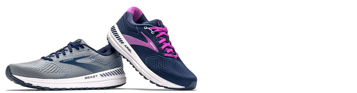 brooks beast and ariel running shoes on white background