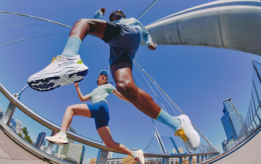 2 runners wearing hoka arahi 8 running shoes