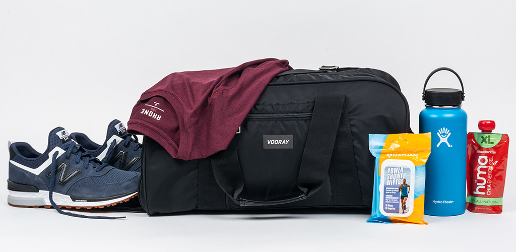 Tennis shoes, tennis bag, Contigo water bottle, energy gels, and body wipes
