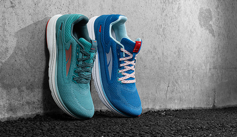 Men's White and Women's Blue Altra Escalante 3 running shoes on a clean white background.