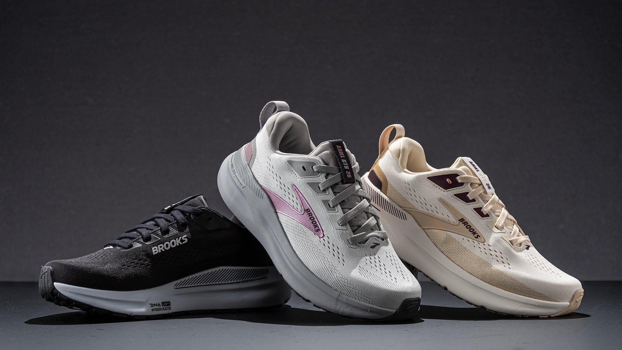 a pair of black Brooks Ariel GTS women's running shoes with white accents on a white background