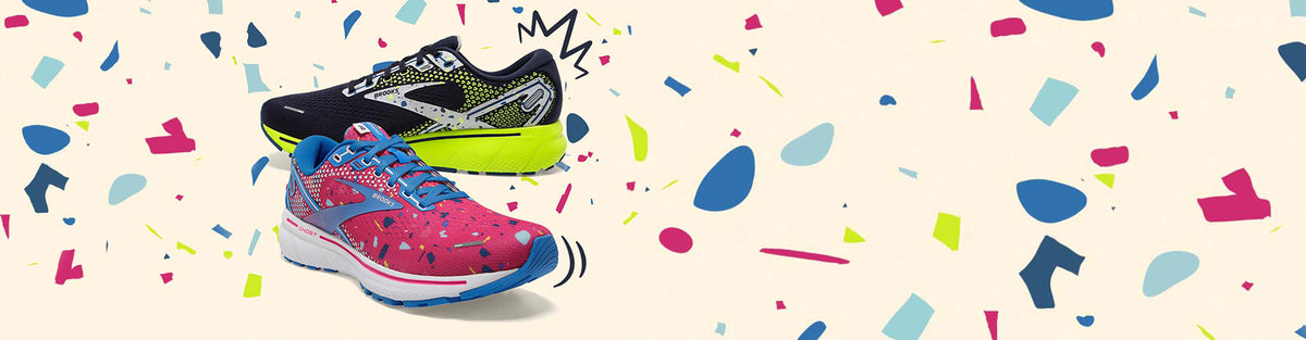 Men's and Women's Brooks Ghost 14 Fuse Collection running shoes on a confetti background.