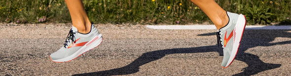 Woman running in Brooks Launch GTS 9 running shoes.
