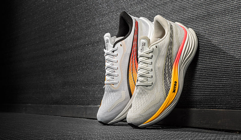 puma velocity nitro 3 running shoes leaning on shadowy wall