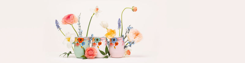 Spring flowers in pastel plant pots