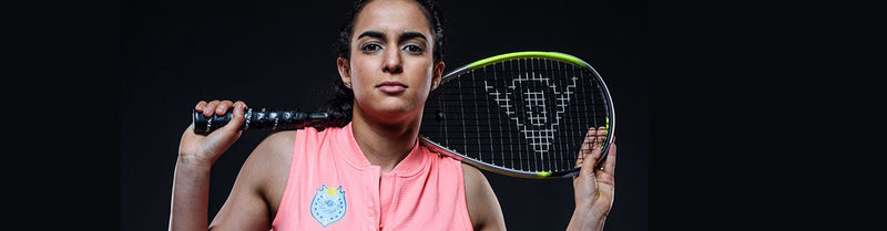 Woman holding Dunlop squash racquet