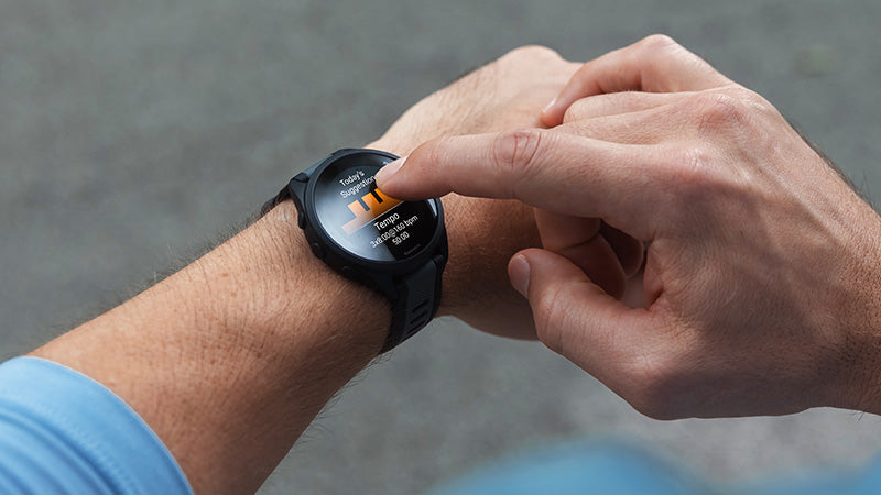 Closeup of a person using a Garmin GPS watch