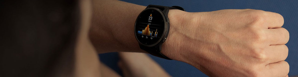 Man looking at Garmin Venu 2 GPS watch