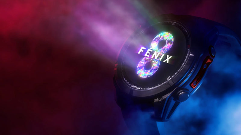 Garmin fenix 8 Pro GPS watch on a dark red and blue gradient background 