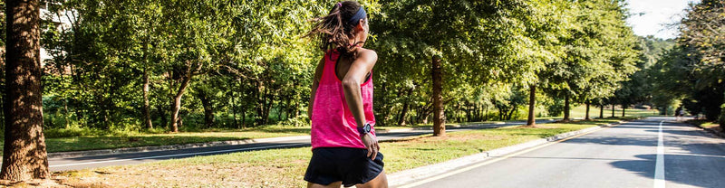 Woman running in Mizuno running apparel