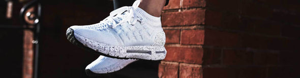 Women in White Under Armour running shoes