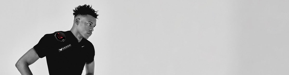 Black and white image of man using Hyperice Venom Shoulder