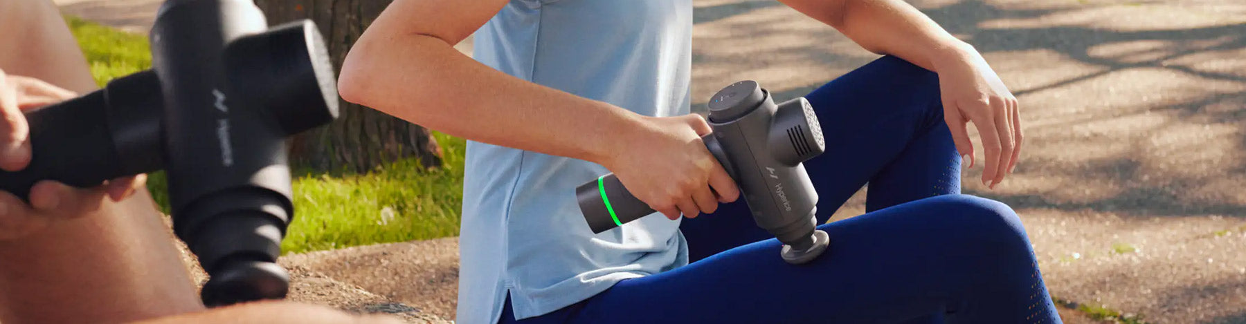 Runners using Hyperice Hypervolt products to massage their legs.