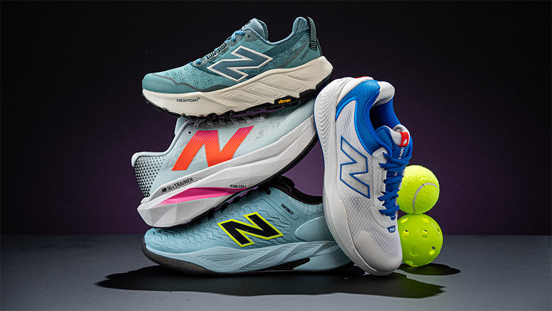 stack of new balance shoes with a tennis ball and pickleball