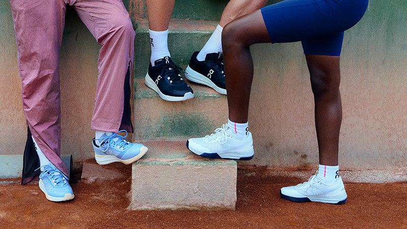 Three people wearing On The Roger Advantage Pro tennis shoes in different colors
