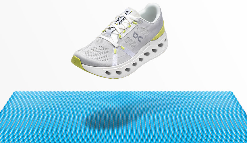 on lcoudeclipse running shoe floating over blue floor