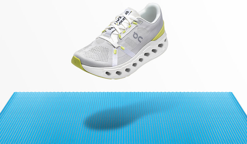 on lcoudeclipse running shoe floating over blue floor