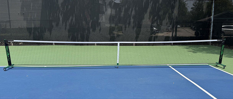 Oncourt Offcourt PickleNet Plus system displayed on a blue and green tennis court