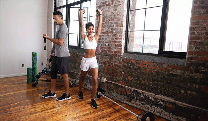 man and woman working out with pro-tec total body resistance bands