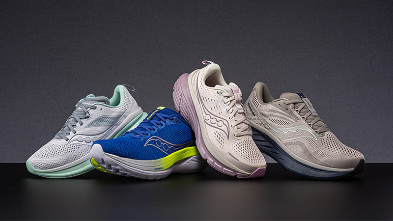 Four pairs of Saucony running shoes in different colors on a dark background