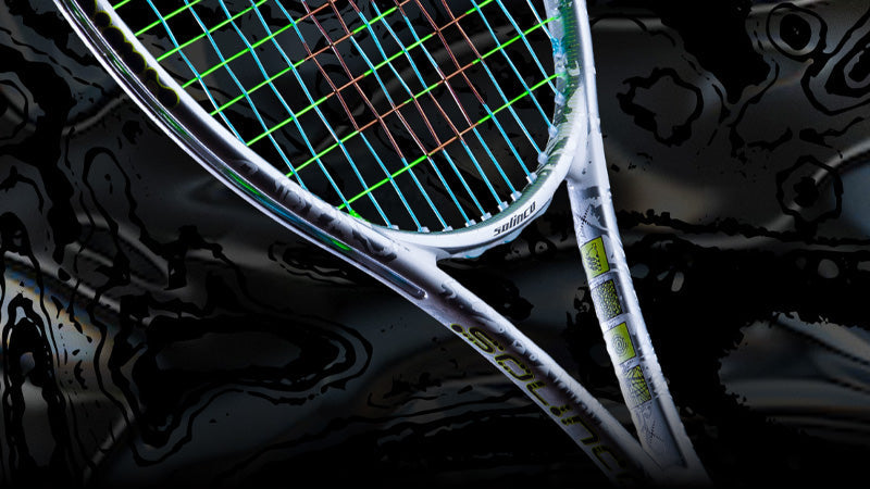 Close-up of a Solinco x Braindead tennis racquet with a dark, abstract background