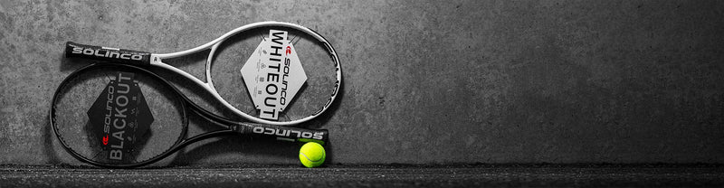 solinco whiteout and backout racquets on dark background
