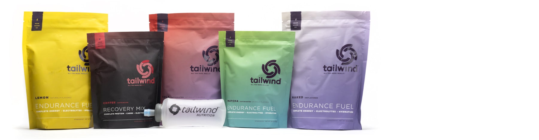 Assorted flavors and types of Tailwind Nutrition in colorful, 15 to 50 serving packages and one Tailwind Nutrition Soft Flask.