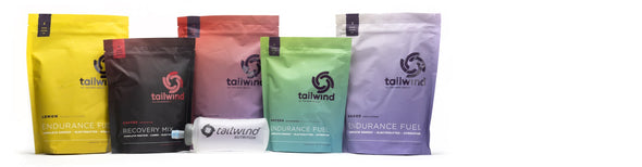 Assorted flavors and types of Tailwind Nutrition in colorful, 15 to 50 serving packages and one Tailwind Nutrition Soft Flask.