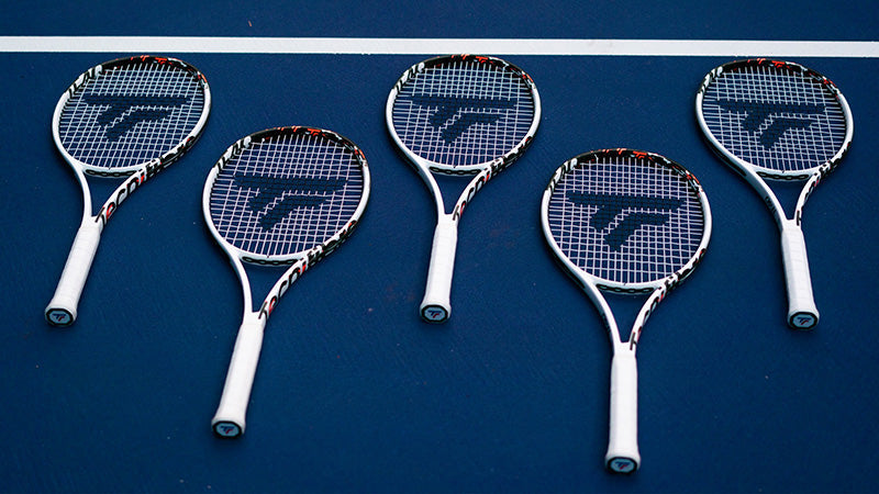 Tecnifibre TF-40 v3 tennis racquets on a blue court