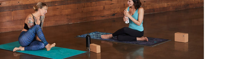 Women with Manduka Yoga Mats