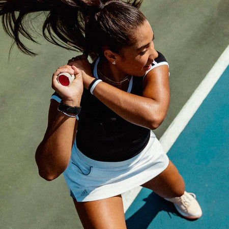 woman holding tennis racquet