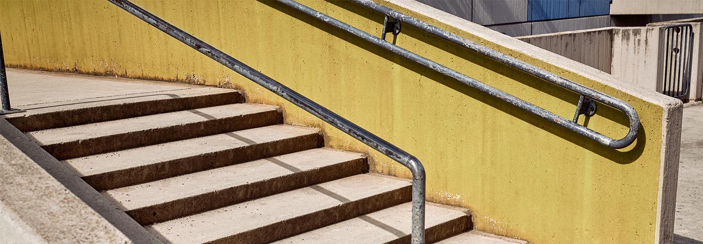 stairs with yellow wall