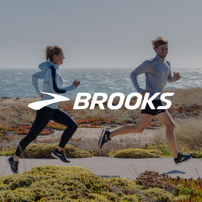 Man and Woman Running in Brooks Running Gear with Logo