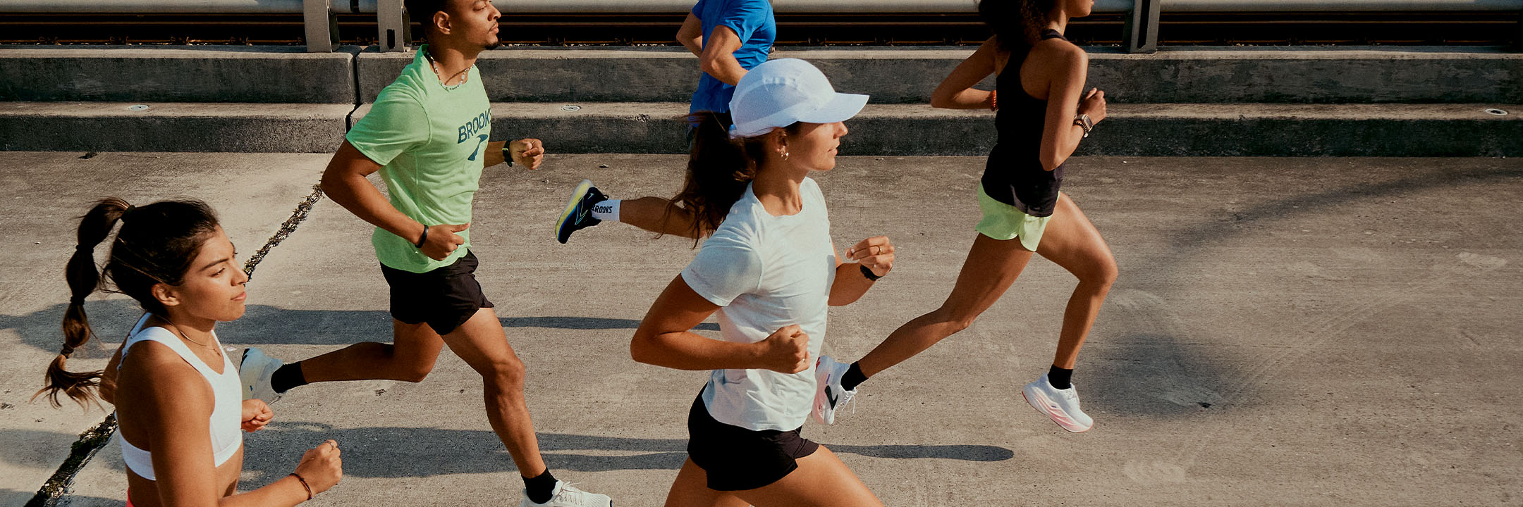A group of people running in Brooks shoes and clothing