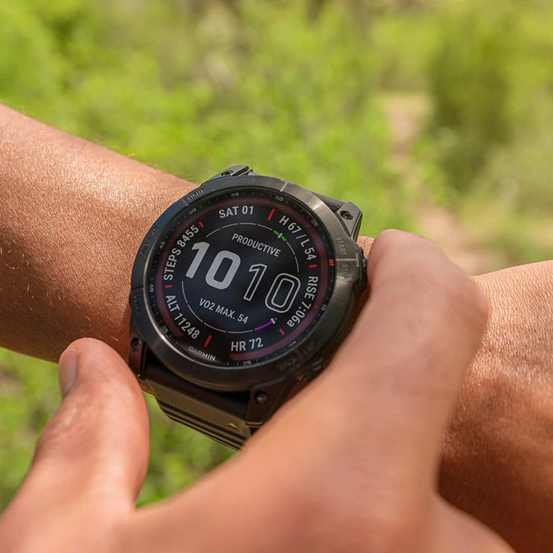 Lifestyle image: a person wearing a black Garmin fenix 7 GPS watch.